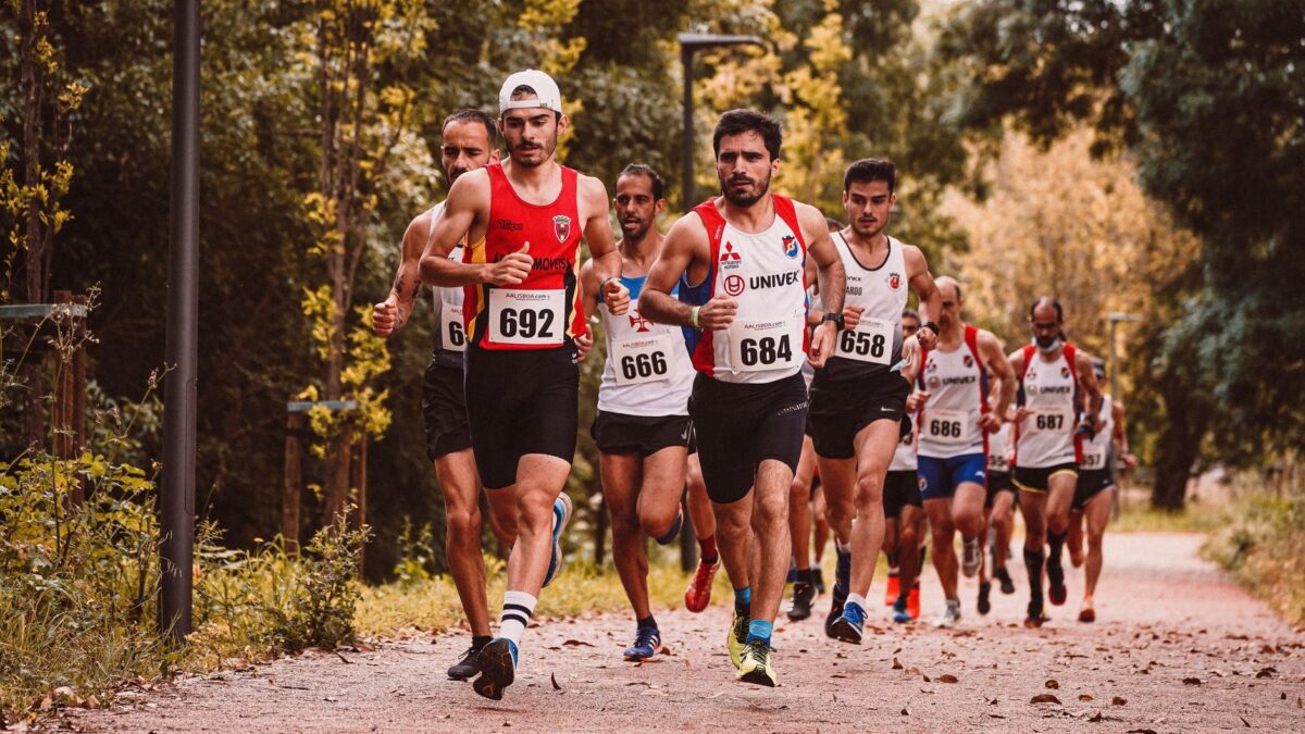 A dynamic scene of male athletes participating in an outdoor marathon race.