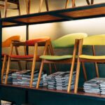 möbel heinrich kirchlengern - Vibrant modern wooden chairs arranged on shelves in a stylish furnitur